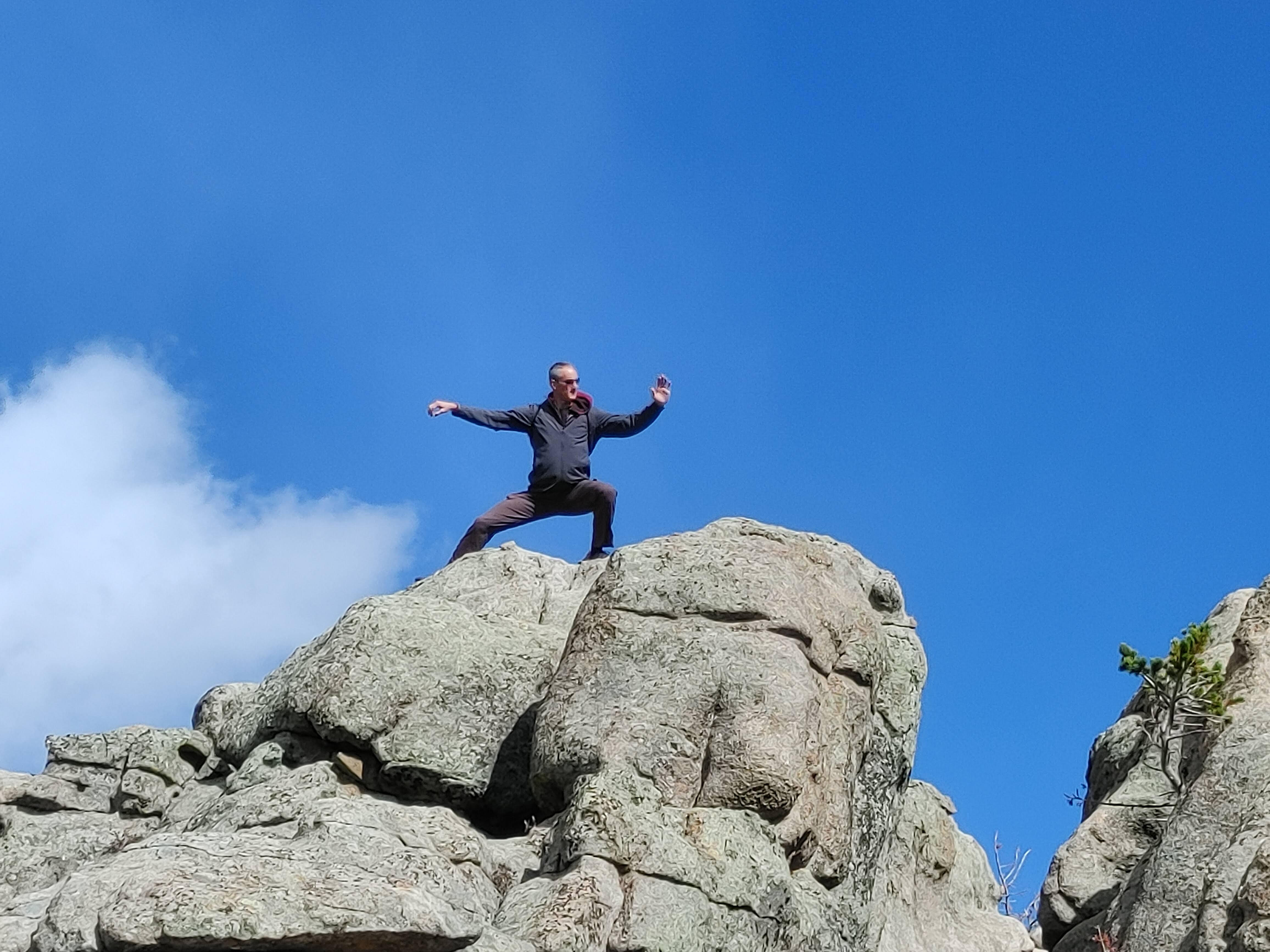 Show off on top of a mountain